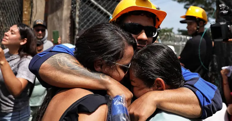 উদ্ধারের পর স্বজনদের সঙ্গে শ্রমিকরা